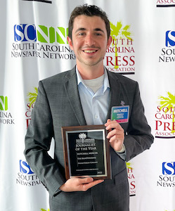 Mitchell Mercer with Student Journalist of the Year award