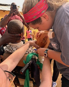 Occupational therapy students work with young Kenyans during visit to Africa.