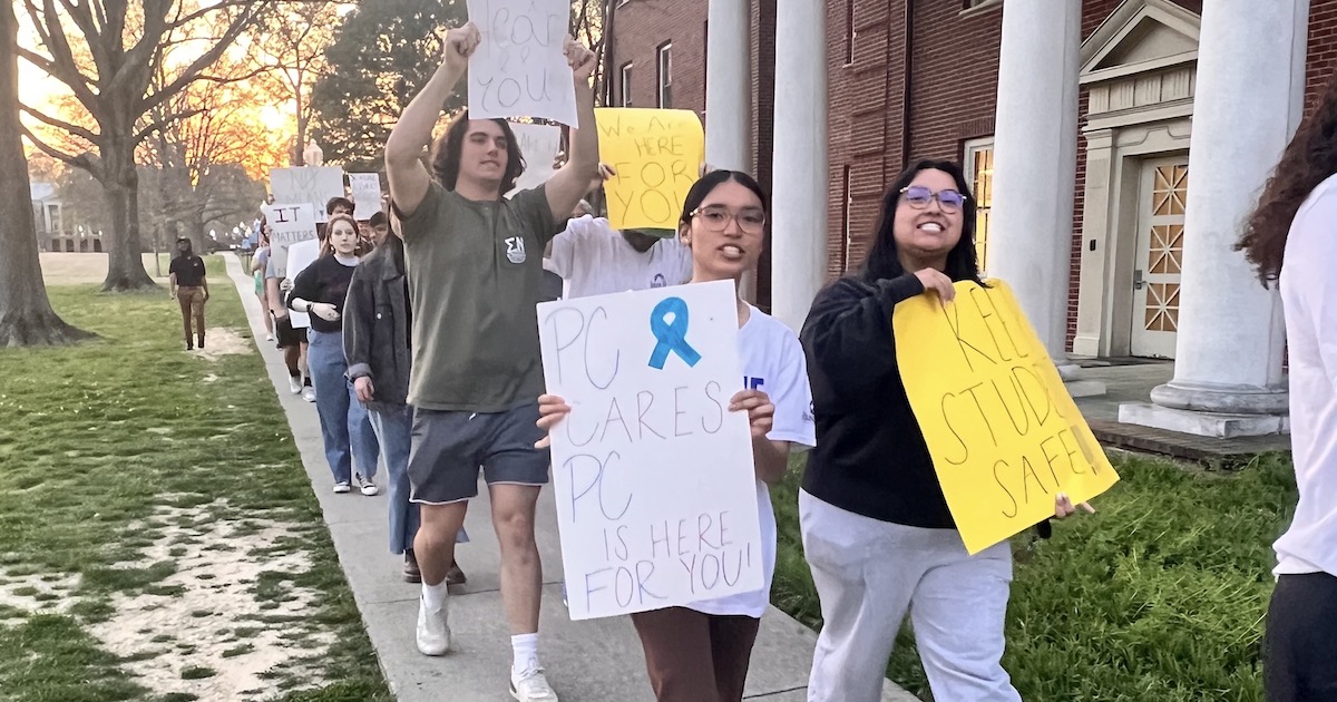 Presbyterian College students march across the East Plaza in support of survivors of sexual assault