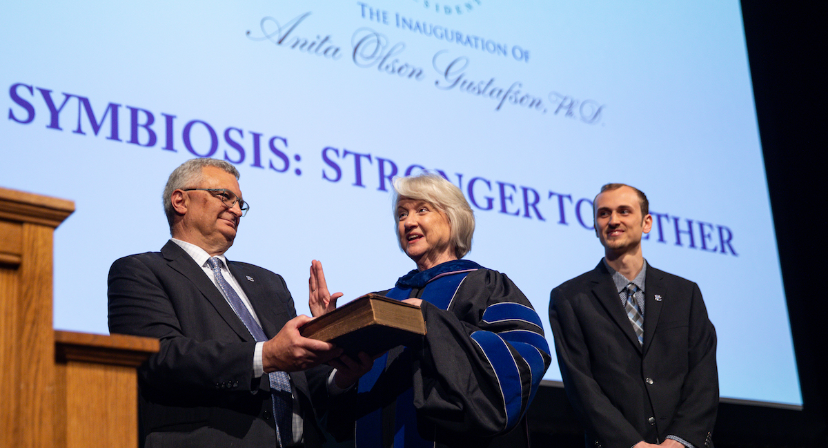 Presbyterian College's 20th president, Dr. Anita Olson Gustafson, was sworn in on April 26. Assisting her as she took the oath of office were her husband, Charlie, and their son, Karl.