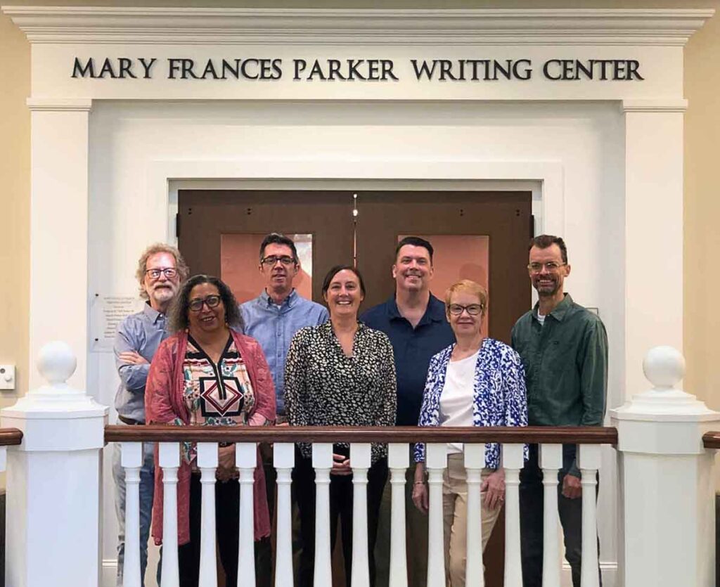 English Faculty group photo in front of Mary Frances Parker Writing Center, From Left to Right: Terry Barr, Kendra Hamilton, Philip Perdue, Emily Taylor, Robert Stutts, Lynne Simpson, Justin Brent