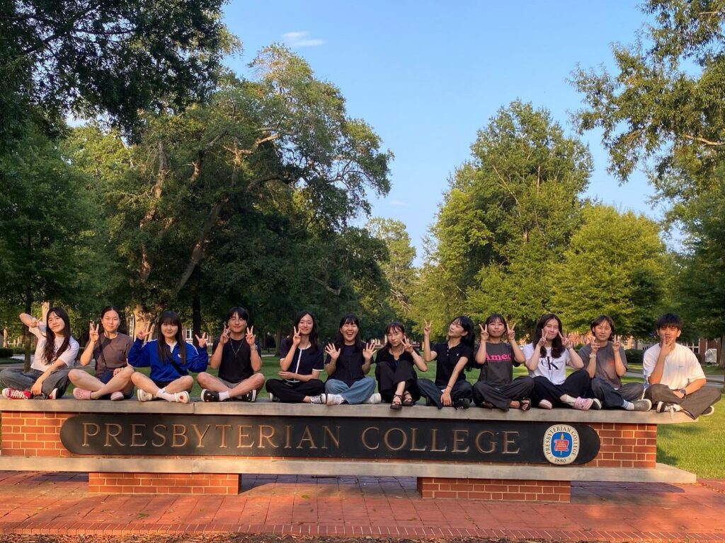 Students on the Presbyterian College Sign