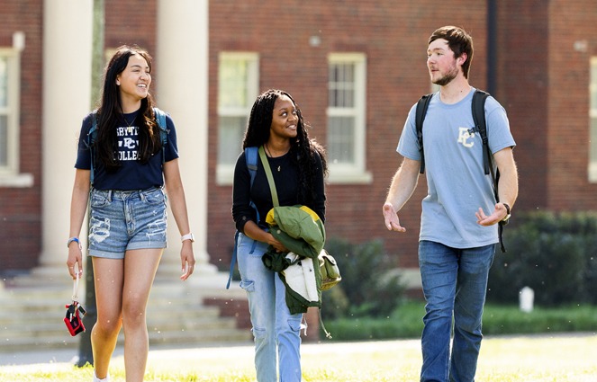 3 Students walking on campus