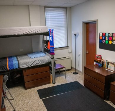 Georgia Hall with a double-decker bed, two wardrobes, and a table for studying