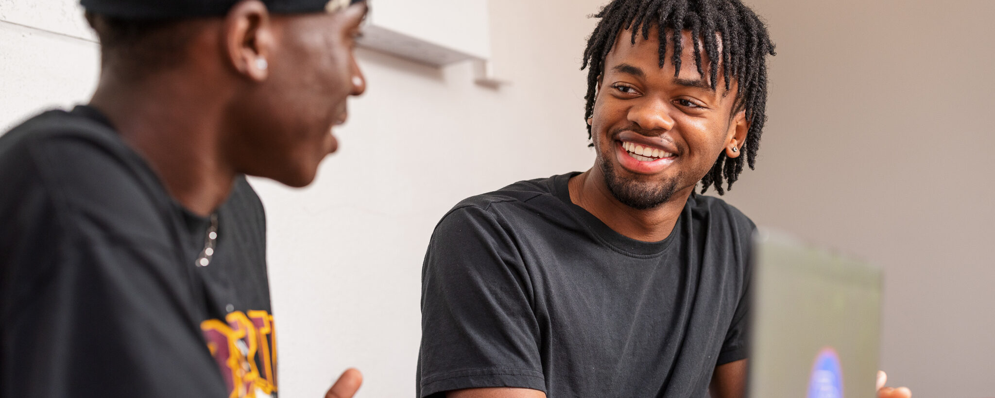 Two students laughing and talking at Presbyterian College