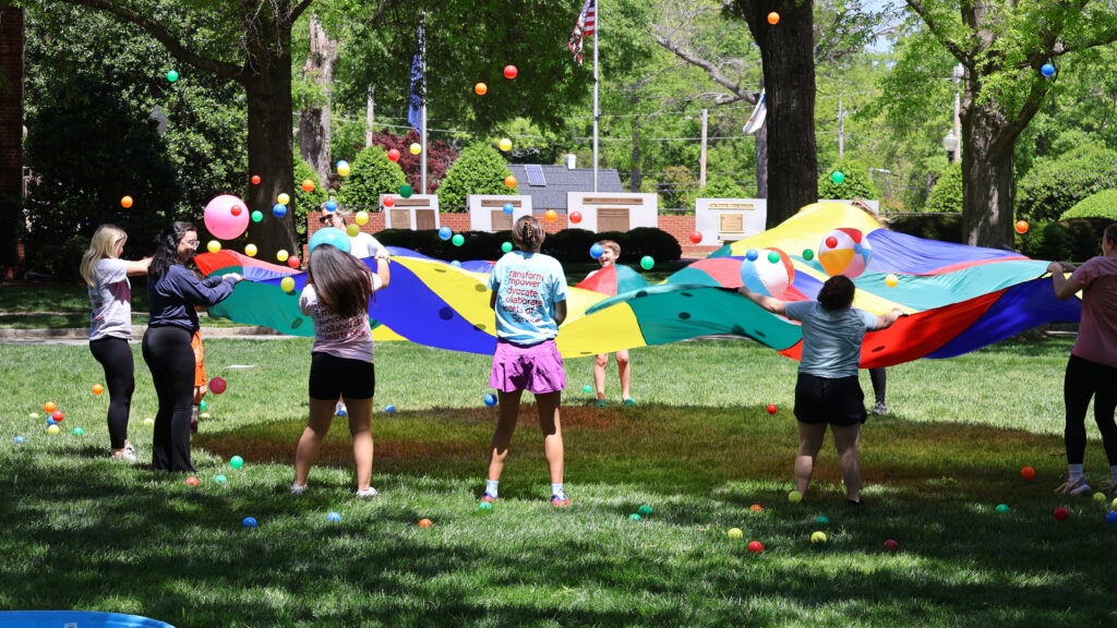 Presbyterian College special education students participating in an outside activity with elementary students.