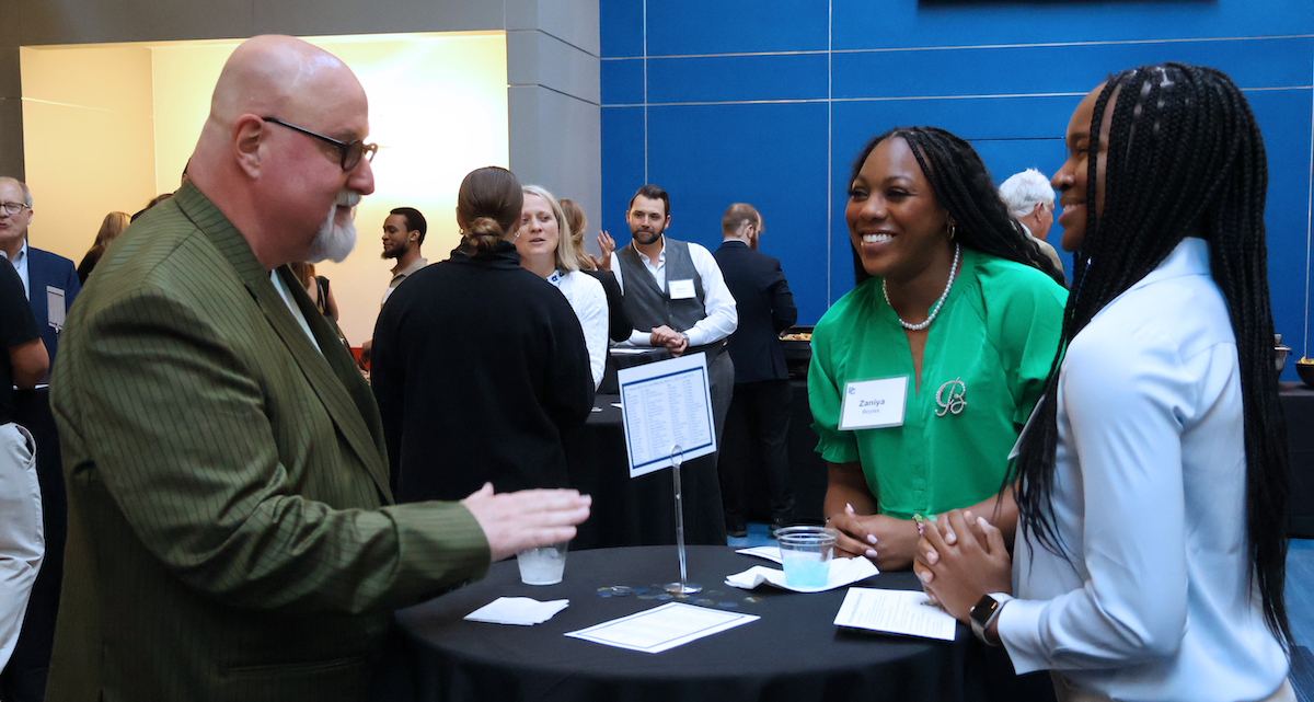 Two Presbyterian College students converse with a PC alumnus during the college's ninth annual Mocktails and Mingling event hosted by the Office of Career and Professional Development.