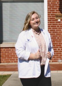 Presbyterian College School of Pharmacy students Savannah McLeod in her white coat.