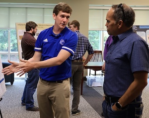 Presbyterian College student Warner Bush presents his political science research during the Summer Research Symposium in July.