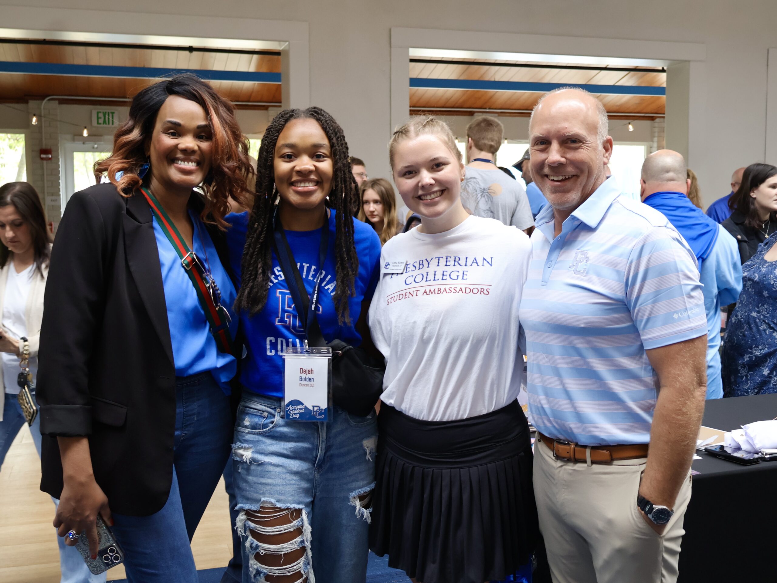 A Presbyterian College professor and student stand with an incoming freshmen and her mother during the Academics and Student Involvement Fair on Accepted Student Day.