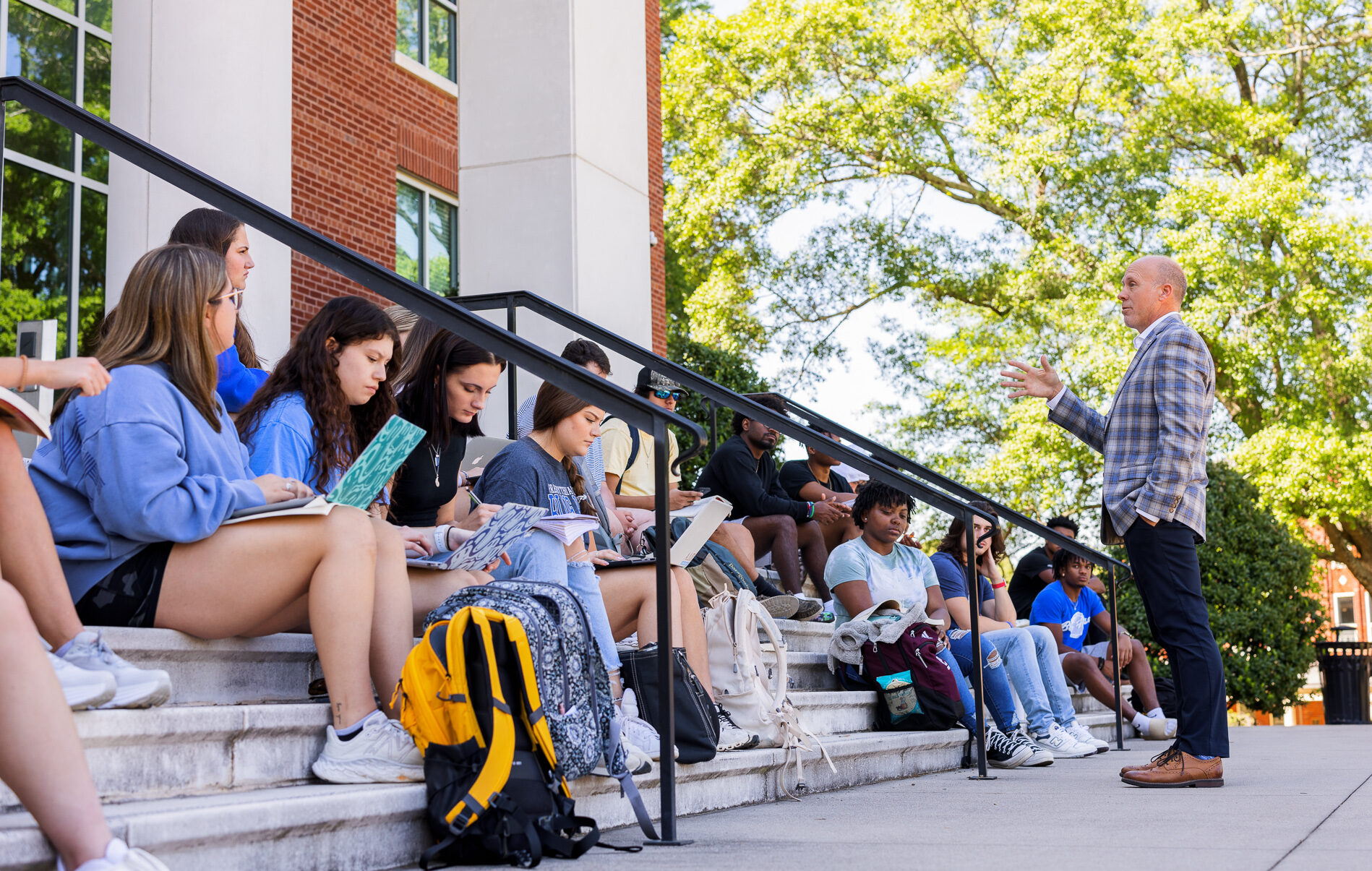 Presbyterian College students having class on the Cornelson Center steps.