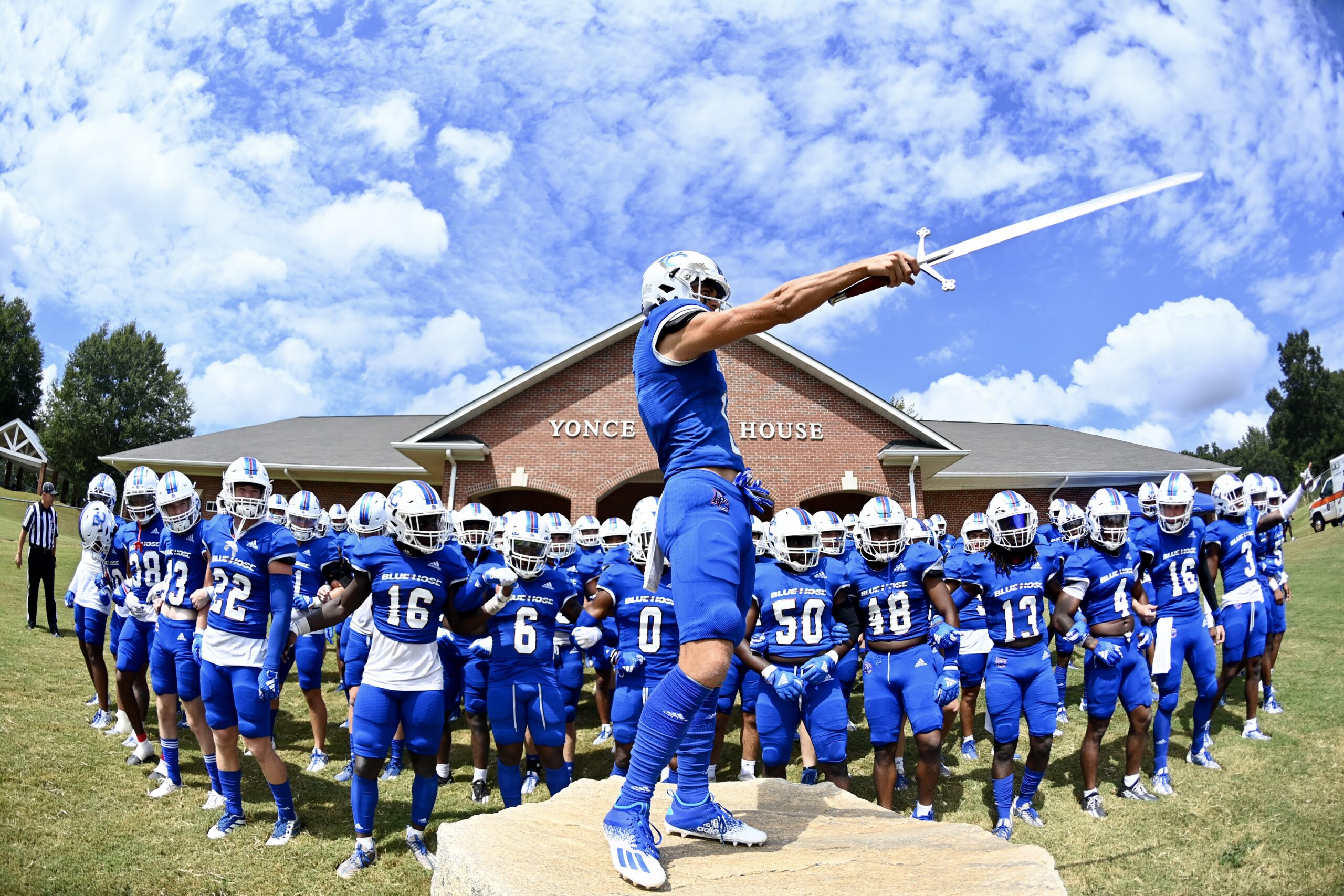 The football team gathered at Bailey Memorial Stadium before a game.