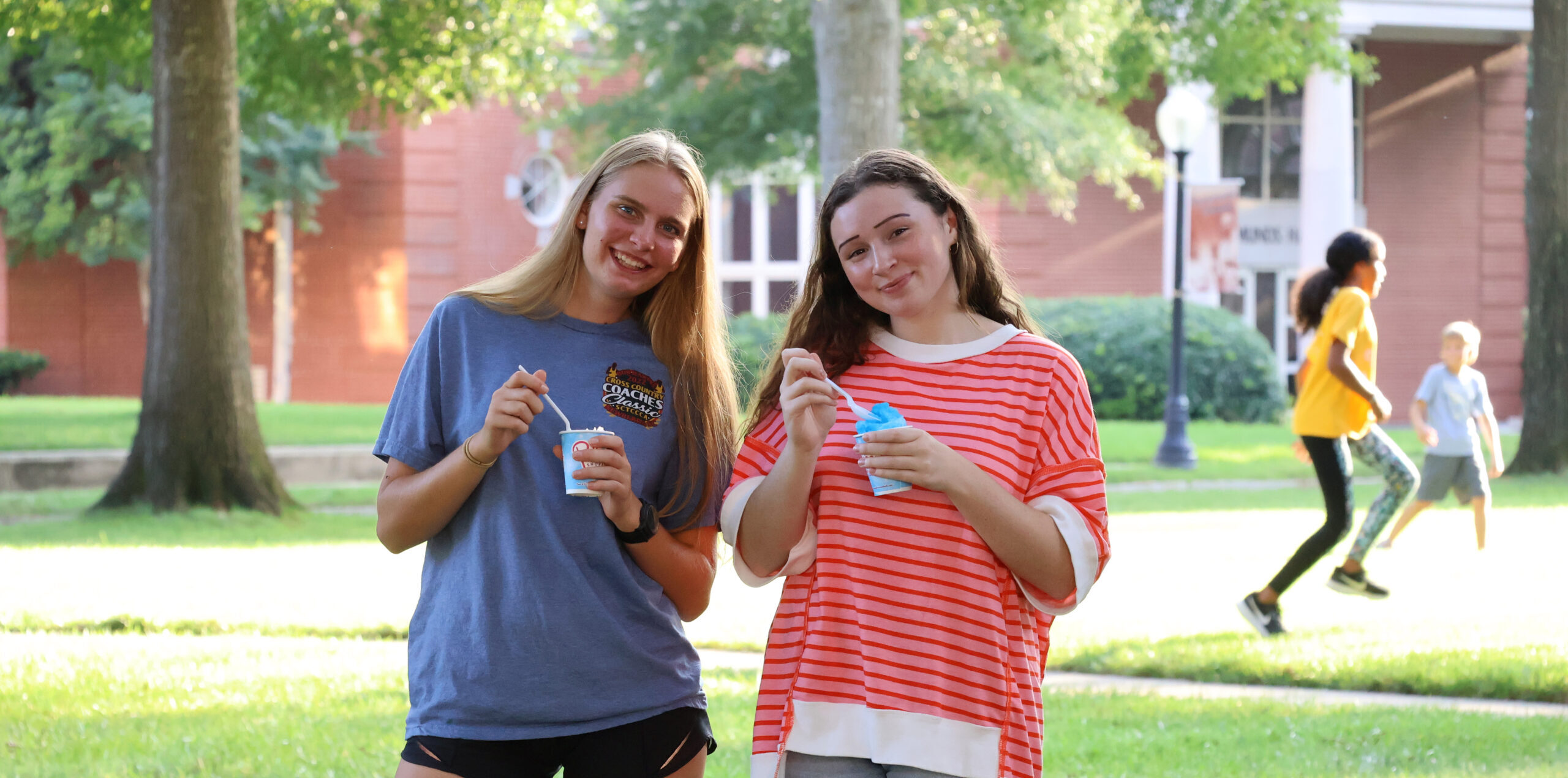 Presbyterian College students posing on the lawn with snow cones.