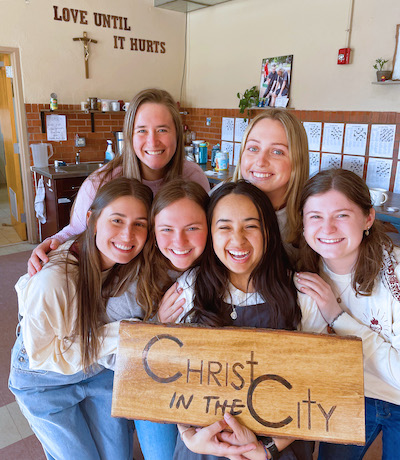 Kimberly Carson (front row, far left) is a first-year students at Presbyterian College's physician assistant program. During a gap year following her graduation from the University of Georgia, Carson volunteered for the homeless ministry, Christ in the City.