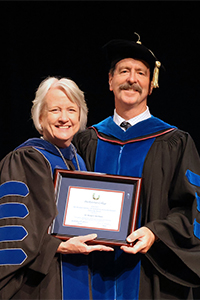 2025 Honors Convocation of Michael Rischbieter accepting the President Emeritus Dr. Kenneth B. Orr Faculty Research Fellowship