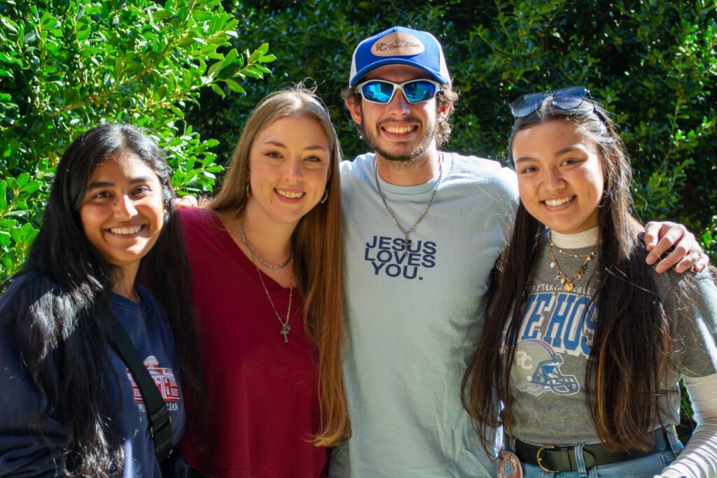 Presbyterian College students taking a photo at Homecoming.
