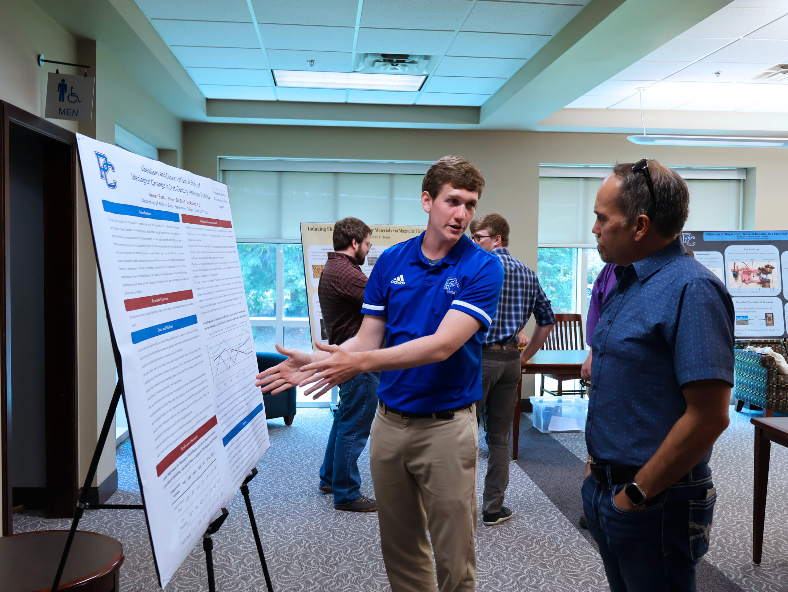 Presbyterian College student presenting summer research.