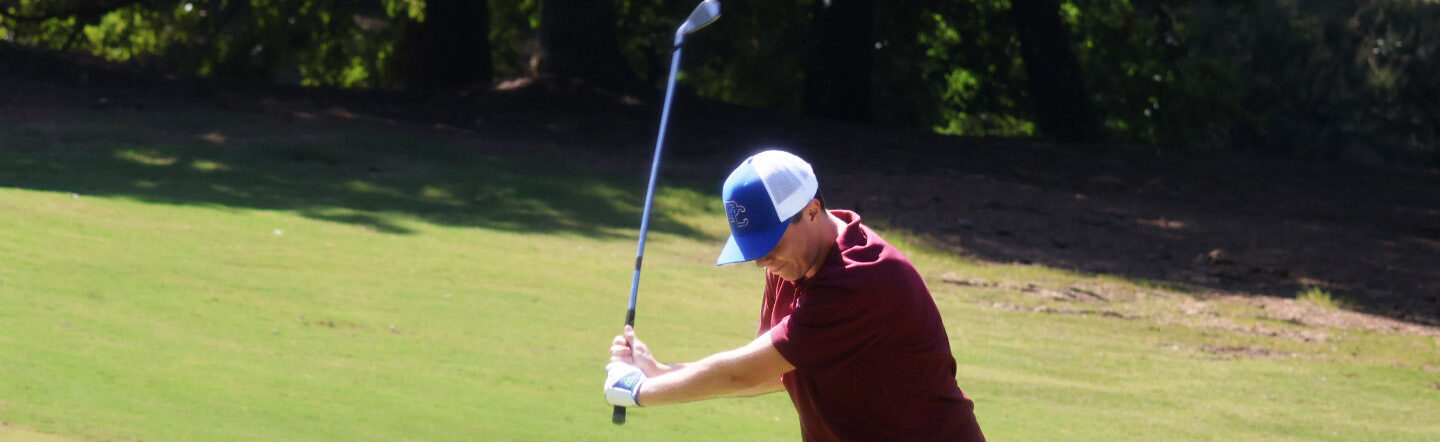 PC student playing in the Welcome Week golf tournament.