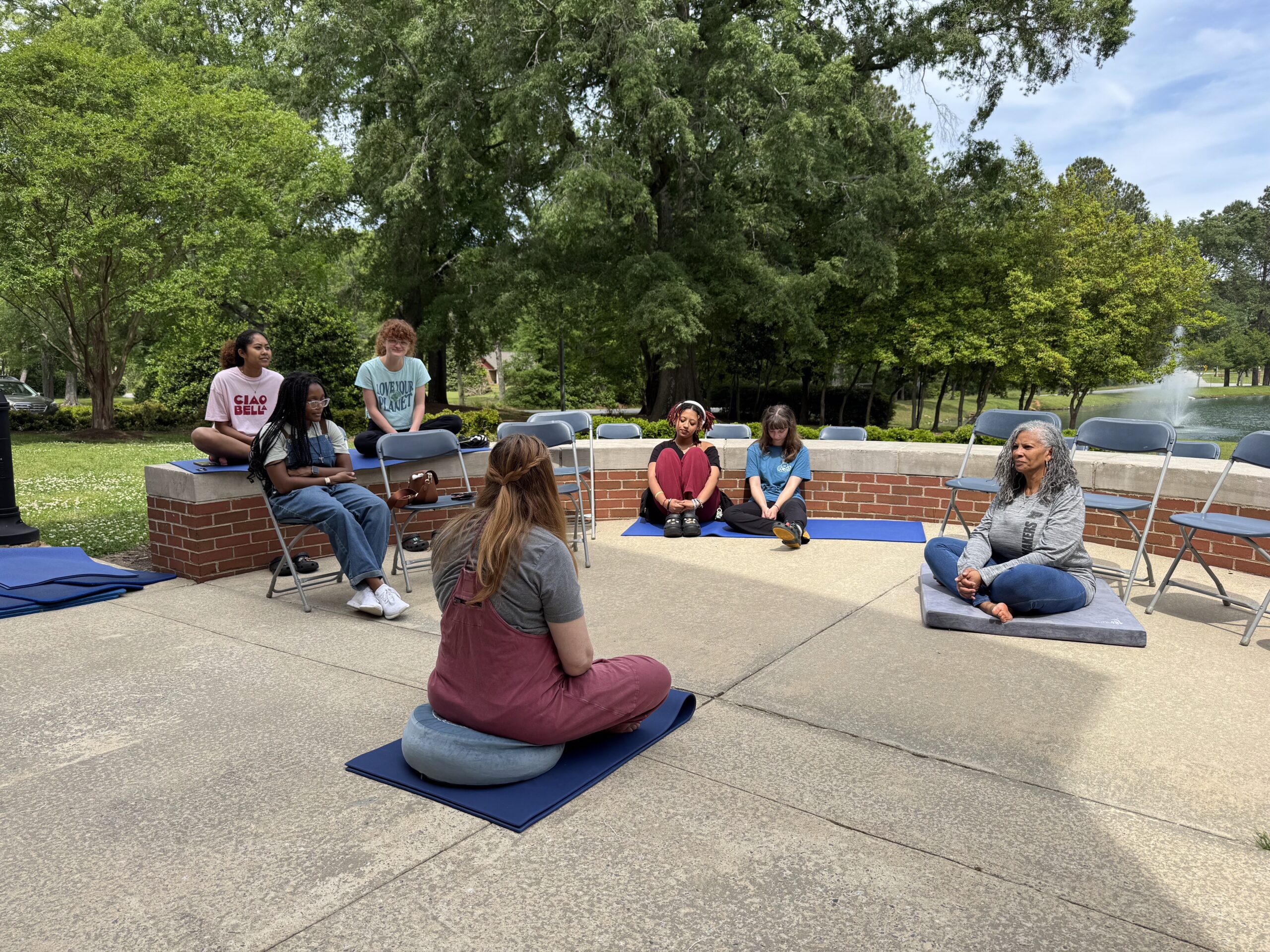 PC students meditating on campus.