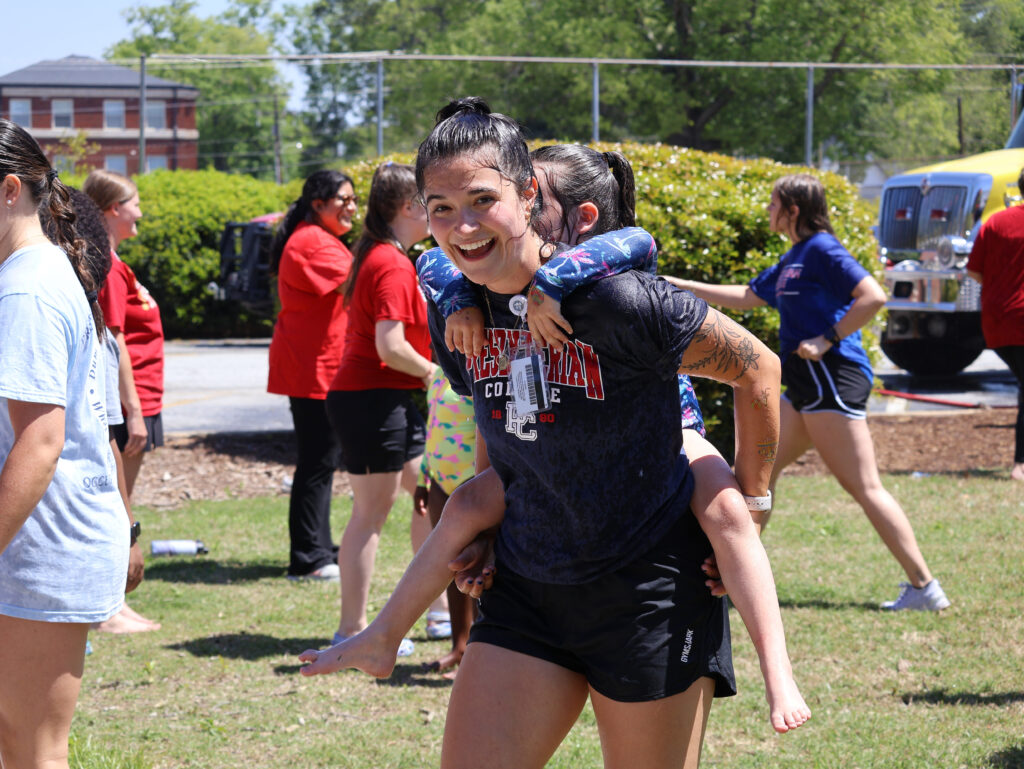 Student carrying child