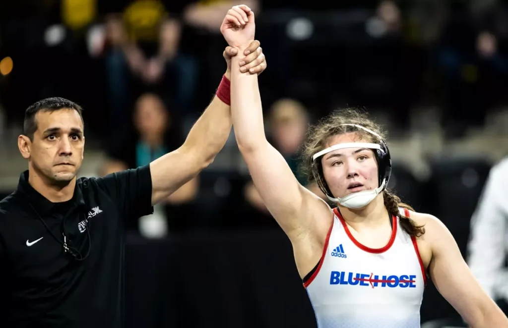 Presbyterian College Women's Wrestler after winning a match. 