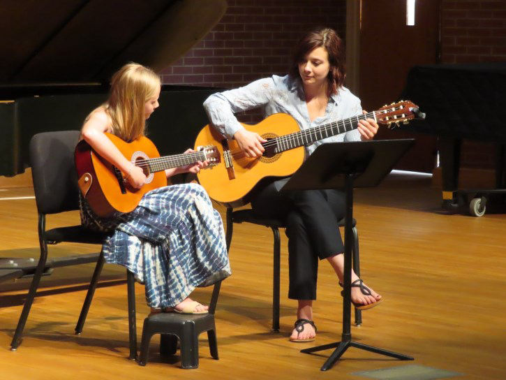 Laurens County Academy of Music student and faculty playing guitar
