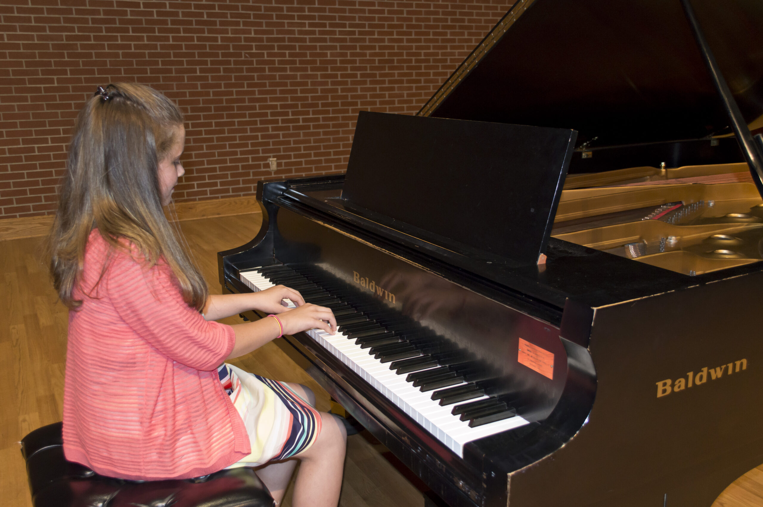 Laurens County Academy of Music student playing piano
