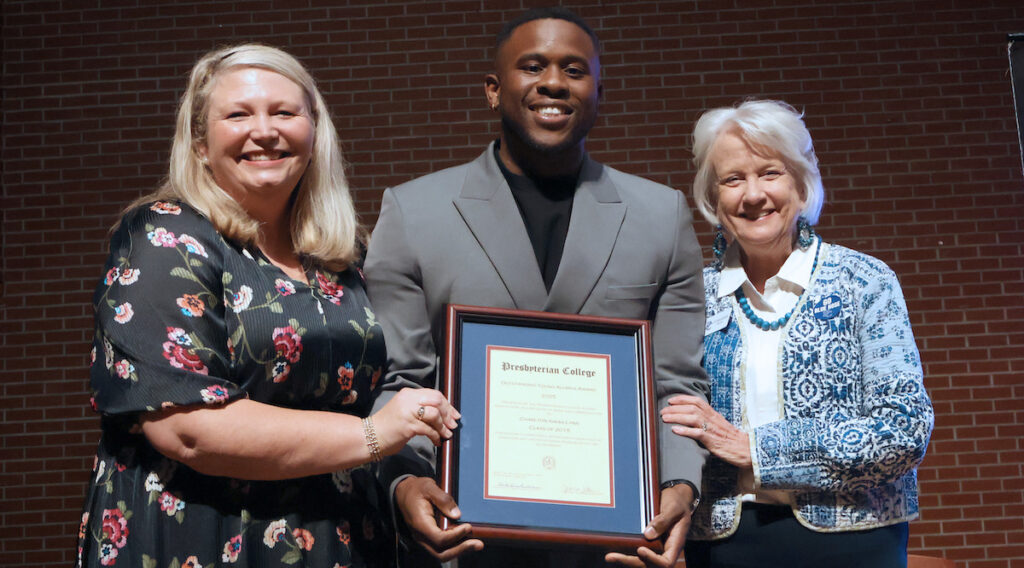 Outstanding Young Alumnus Isaiah Lynn '15 with Jessica Jetton '99, and PC president Dr. Anita Gustafson.