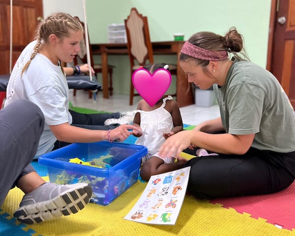 PC OT students working with a child in Belize.