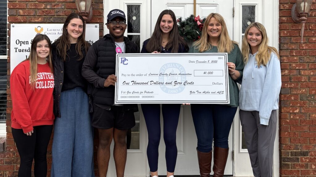 Zeta Tau Alpha presents the Laurens County Cancer Association with a $1,000 donation.