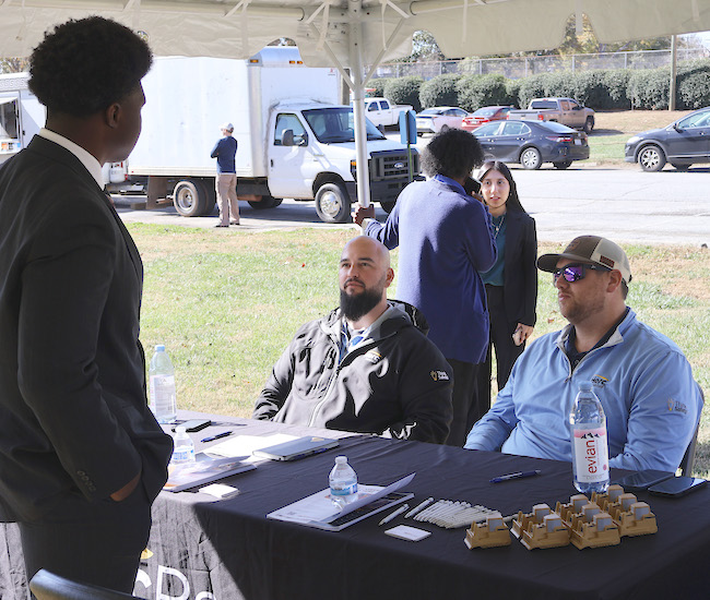 Presbyterian College student meeting with recruiters at the Career Festival on the Lawn.