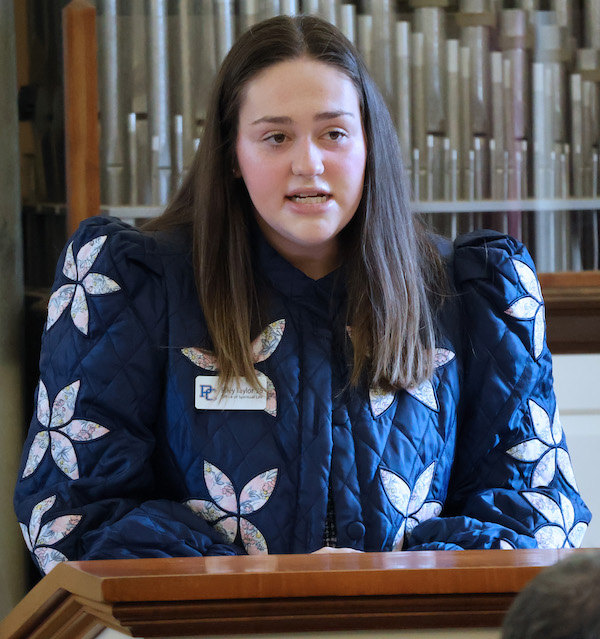 PC senior Riley Taylor reads a section of the new covenant between the college and the Synod of the South Atlantic.