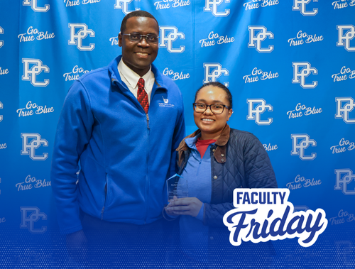 Dr. Serge Afeli with student at Presbyterian College School of Pharmacy's annual awards day ceremony.