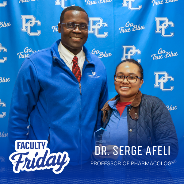 Dr. Serge Afeli with student at Presbyterian College School of Pharmacy's annual awards day ceremony.