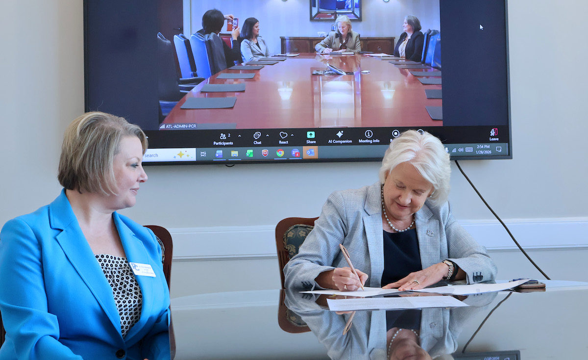 Presbyterian College president Dr. Anita Gustafson sings a memorandum agreement with Mercer University which would provide a pathway for PC students interesting a career in nursing to get a degree in nursing in five years.