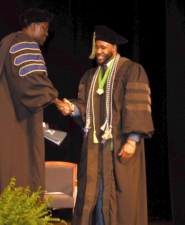 Dr. Jamal Noble '24, an alumnus of the Presbyterian College School of Pharmacy during his hooding ceremony.