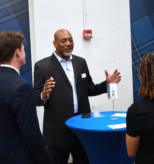 A Presbyterian College alumnus speaks to PC students at the 10th annual Mocktails and Mingling networking event.