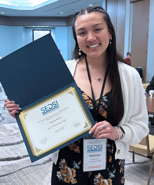 Presbyterian College senior Vanessa Palisin with her first place award at the Southeast Decision Sciences Institute annual conference in Jacksonville, Fla.
