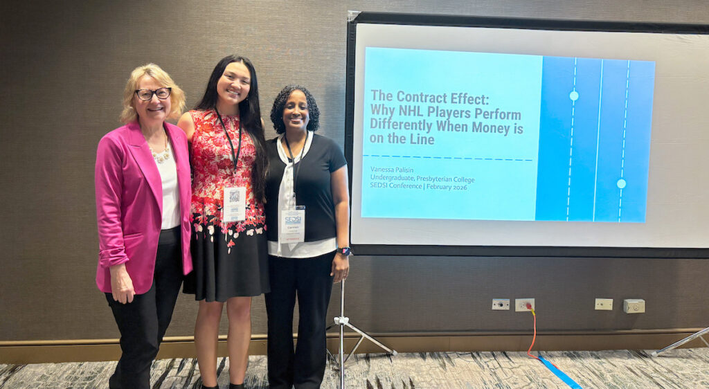 Presbyterian College senior Vanessa Palisin with her first place award at the Southeast Decision Sciences Institute annual conference in Jacksonville, Fla., with professors Dr. Suzie Smith and Dr. Carmen Hall.