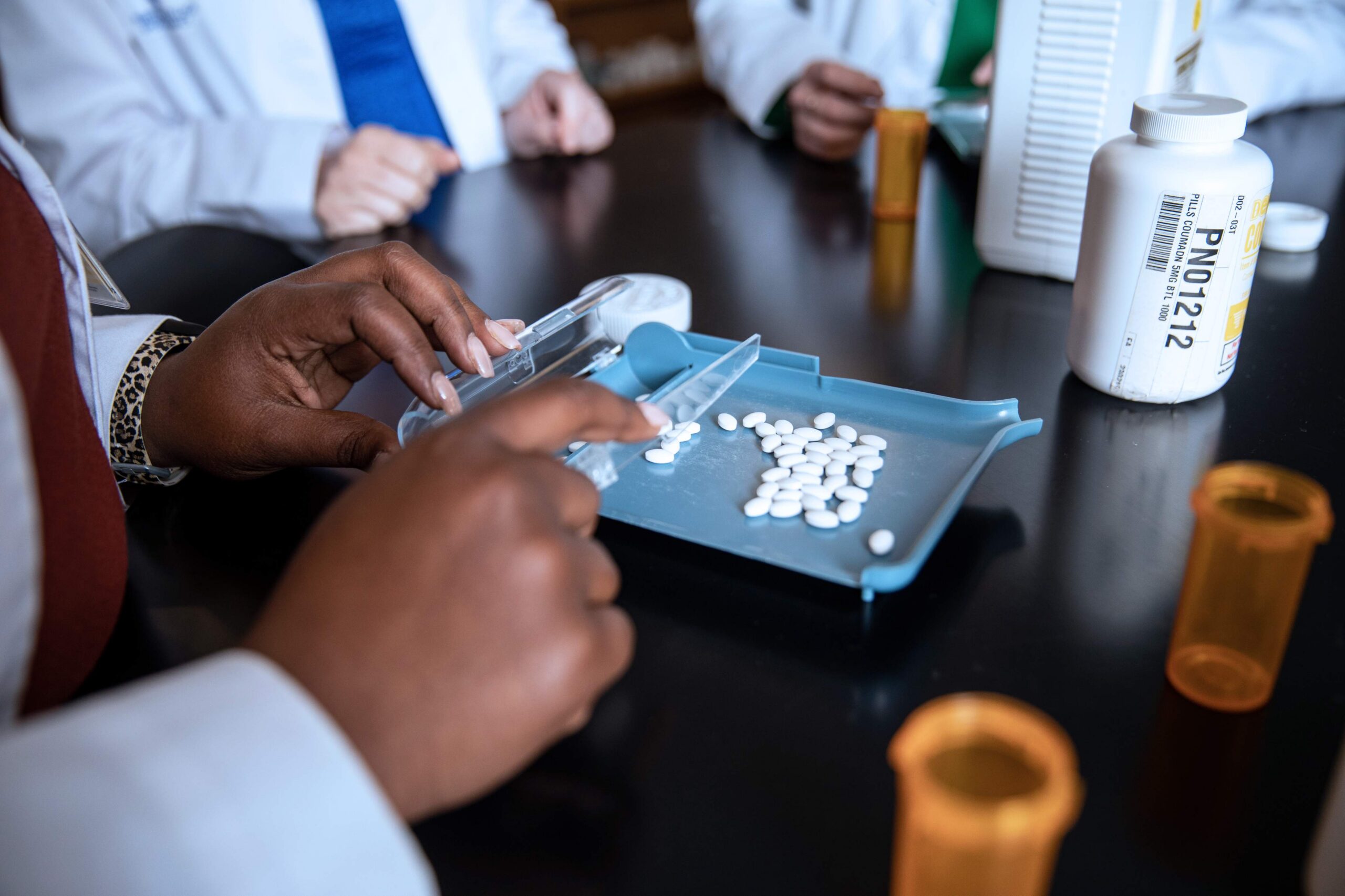 Pharmacy degree students in lab.