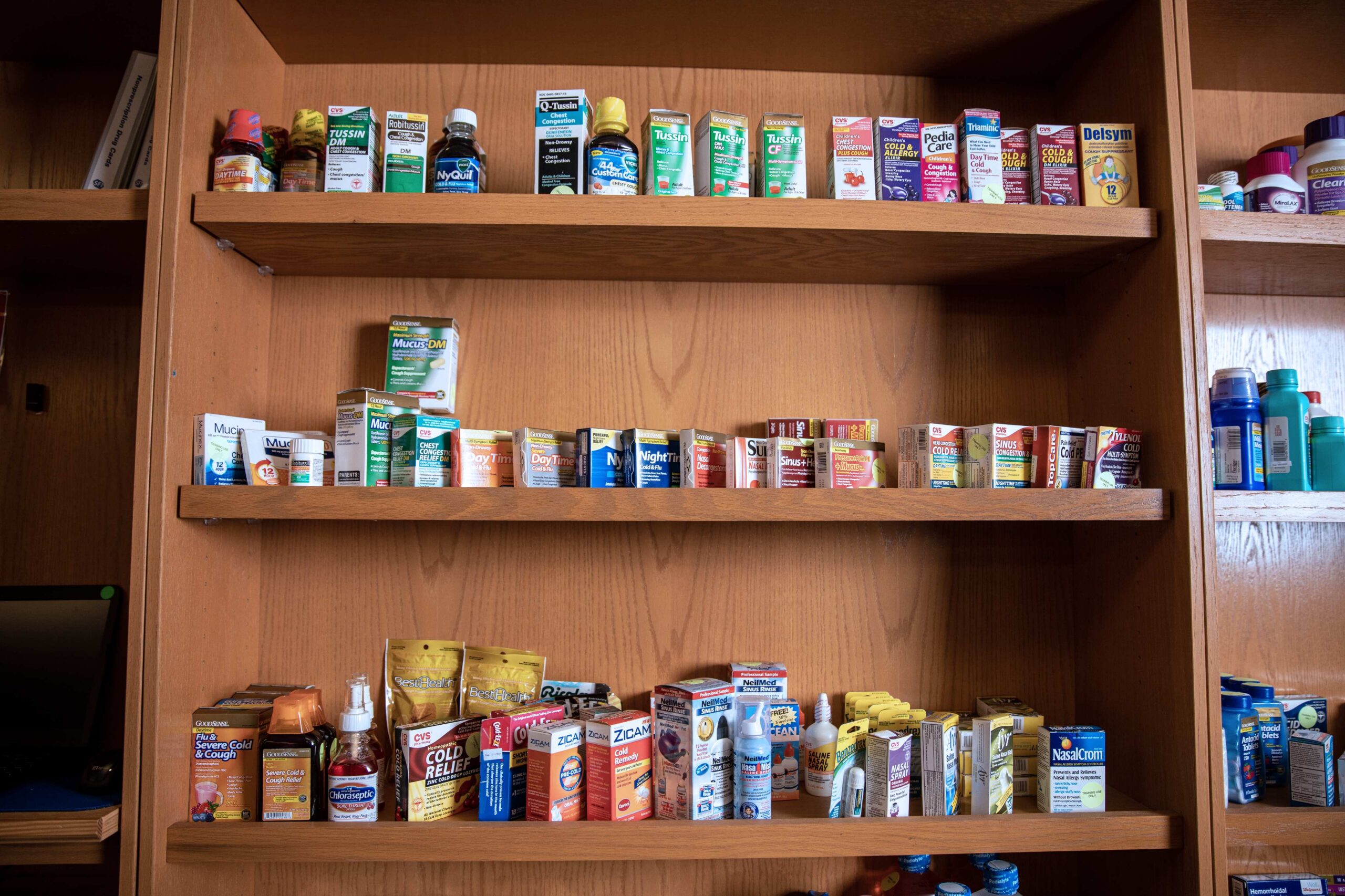 Photograph of medicines in a cabinet.