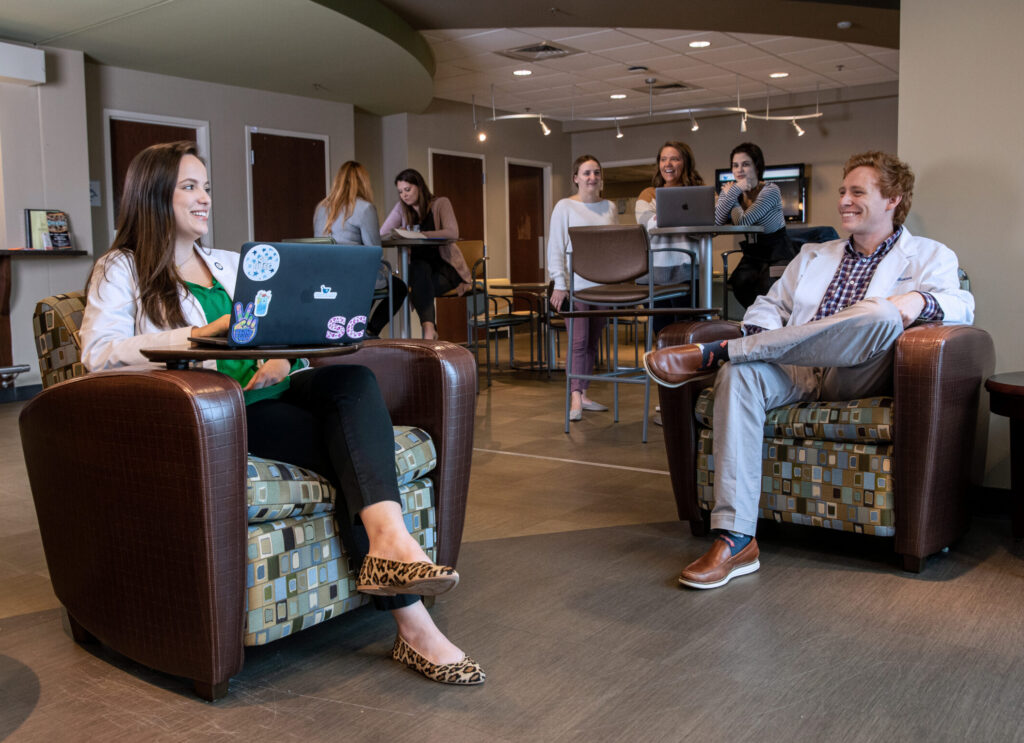 Pharmacy students studying in the lobby