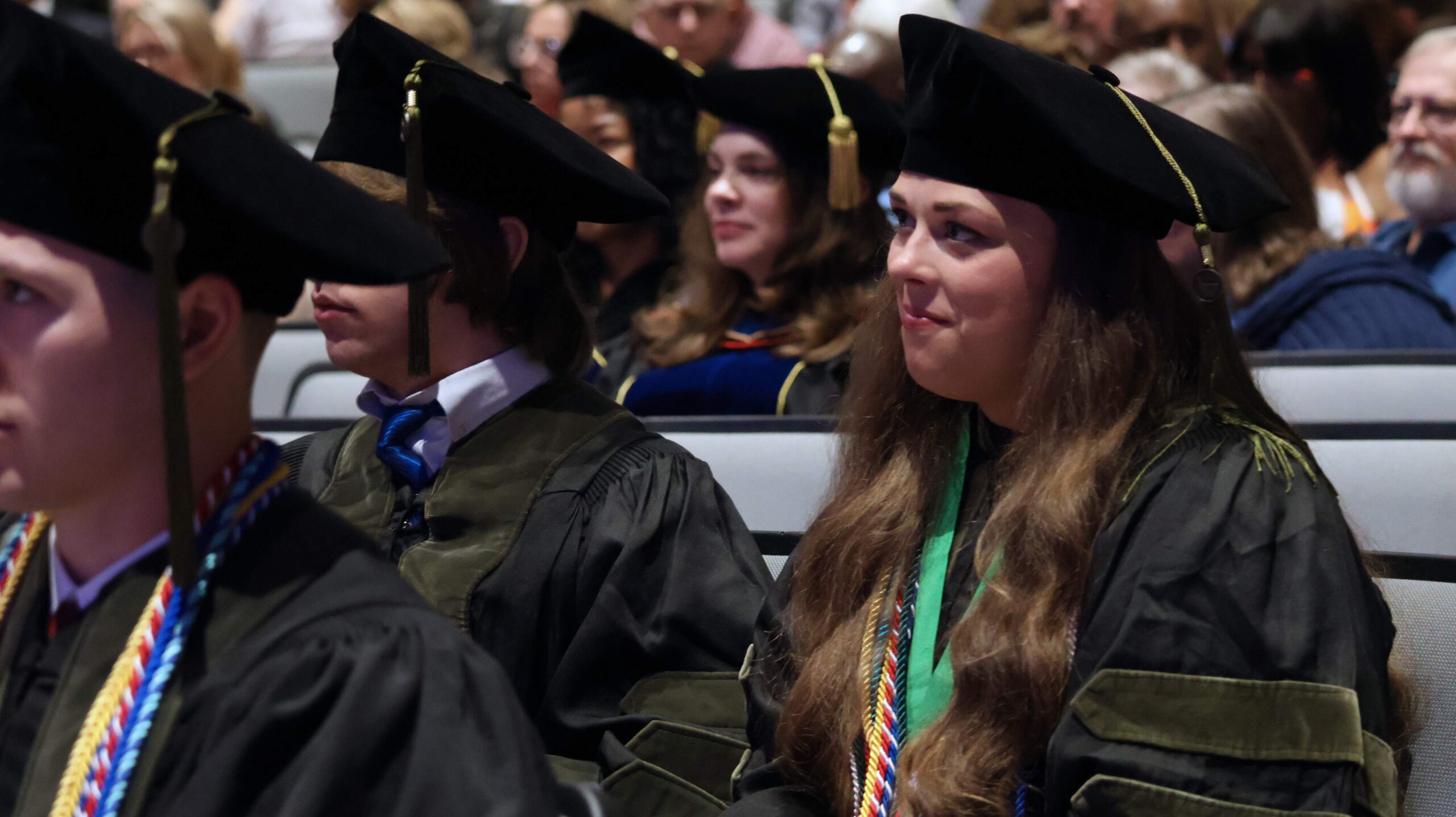 pharmacy student in cap and gown at graduation