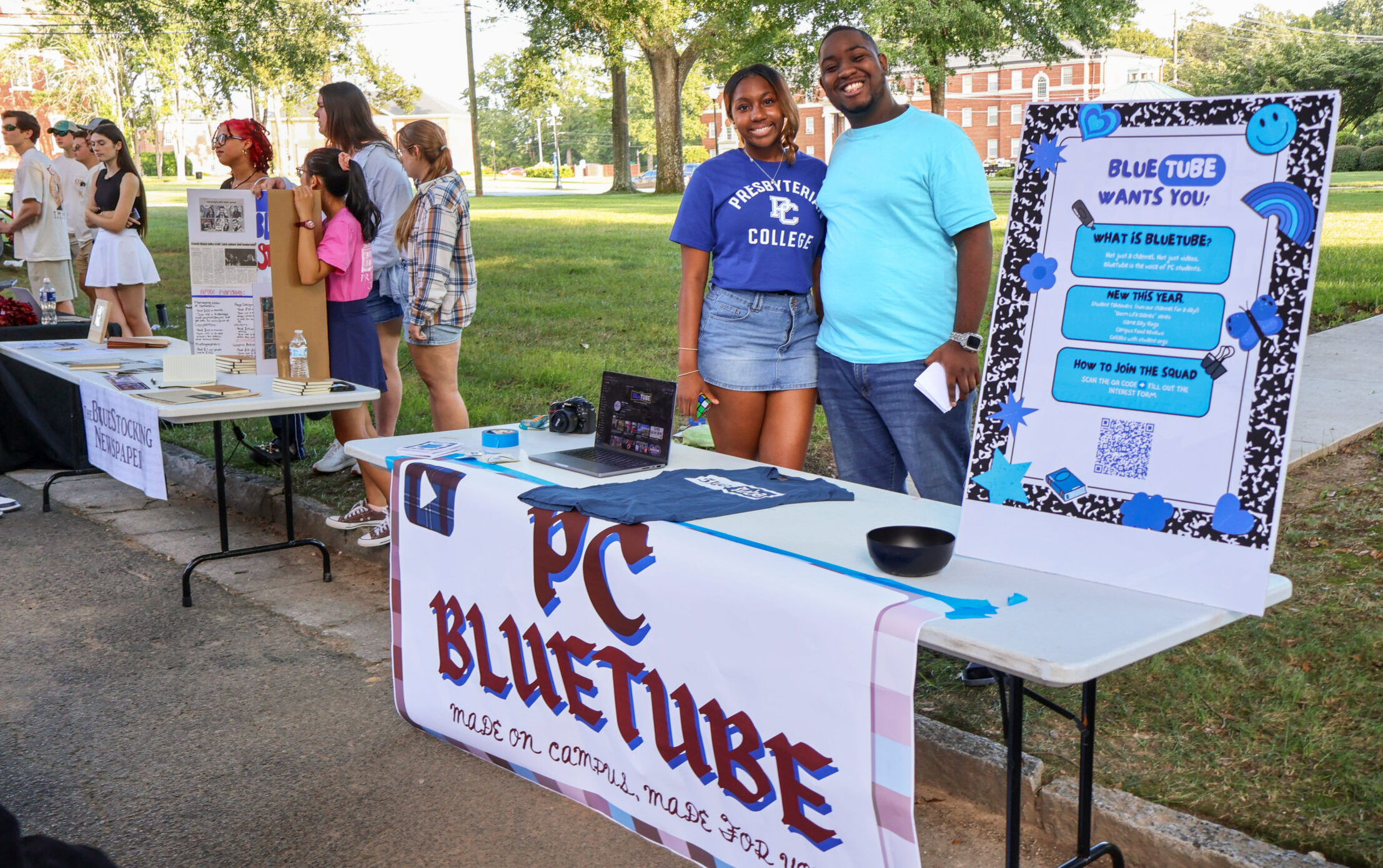 Registered Student Organization fair at Presbyterian College, picturing two students posing at the BlueTube table, a student run YouTube channel.