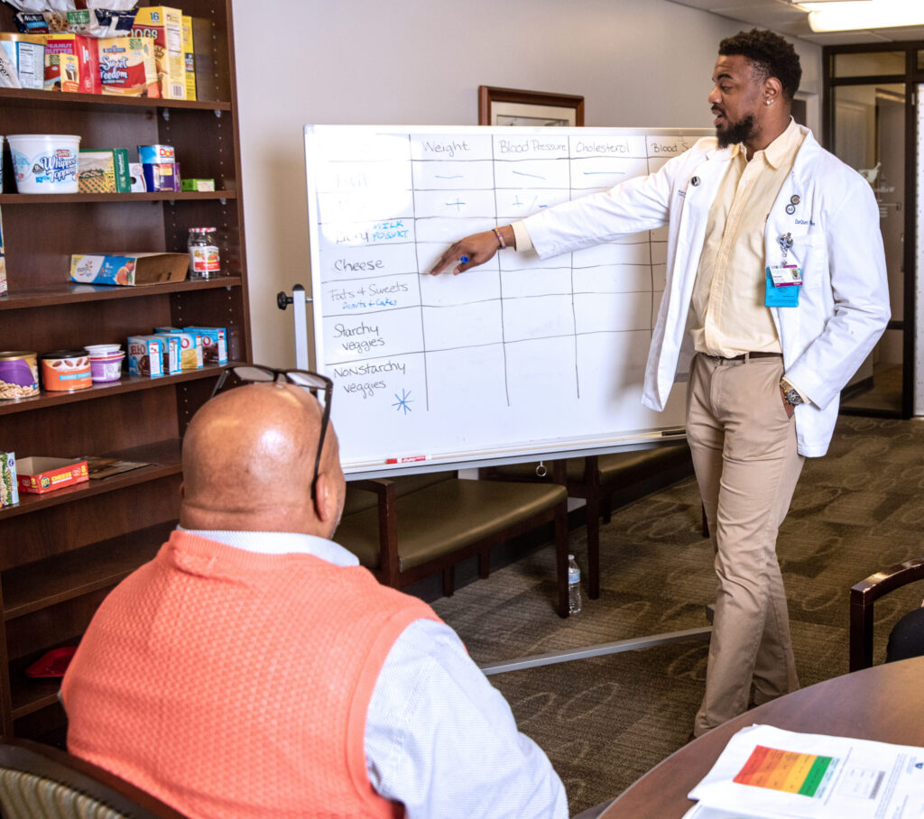 Pharmacy wellness center with student and community member