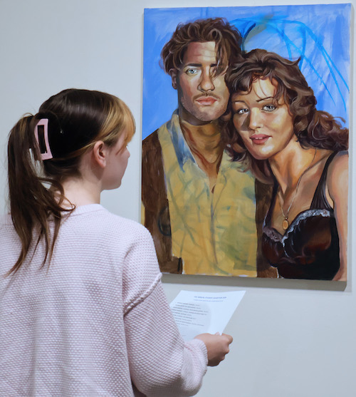 A Presbyterian College students enjoys looking at her fellow students' work at the college's annual student art exhibition.
