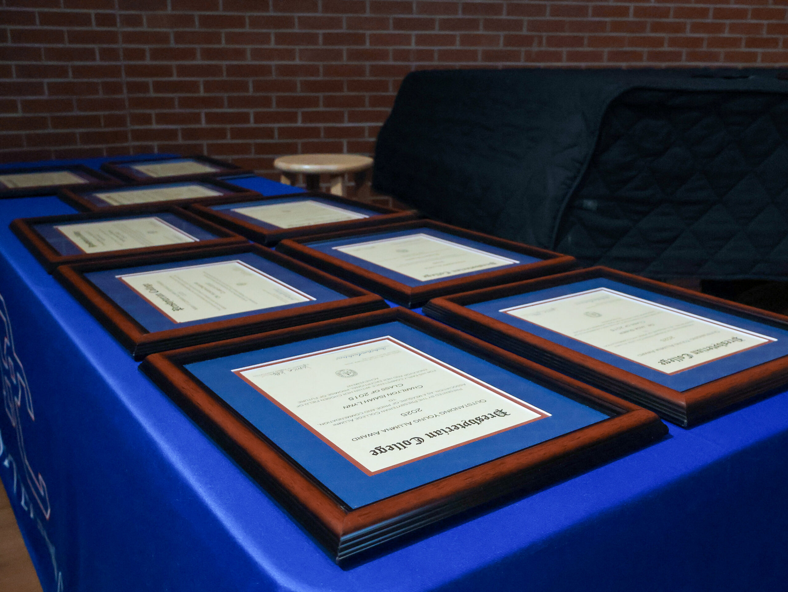 Photo of a table displaying the 2025 Alumni Awards at Presbyterian College.