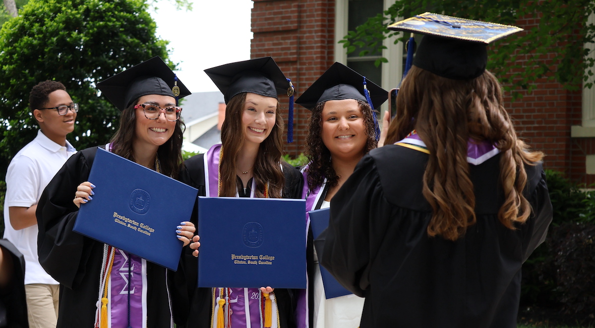 Sorority sisters from Sigma Sigma Sigma take pictures together after graduating on May 9 from Presbyterian College, a prominent liberal arts college.