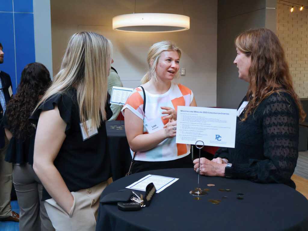 Career and Professional Development event, Mocktails and Mingling. Three people conversating at a table.