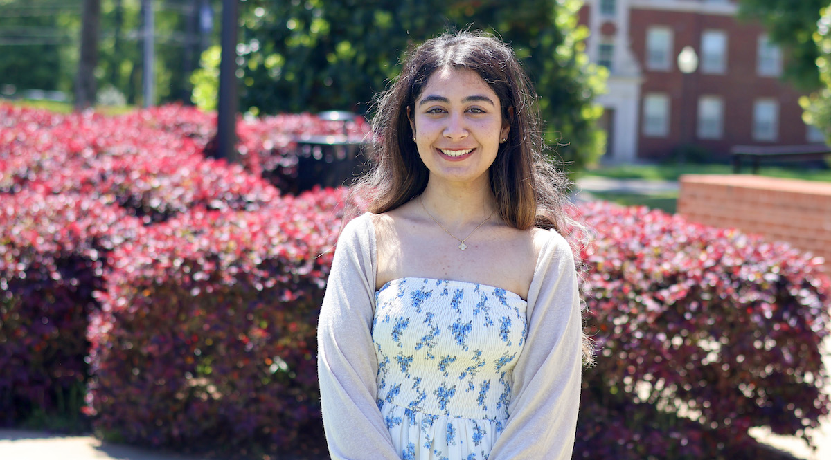 Lydia Awadalla '26, a magna cum laude graduate of Presbyterian College, stands outside of Neville Hall following her presentation on the medieval poetry of Andalusia.